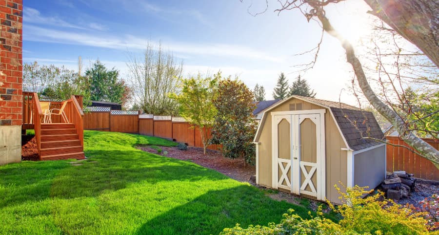 Fenced backyard with storage shed in Worcester